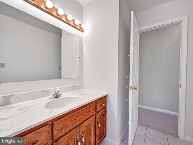 bathroom with tile patterned flooring and vanity