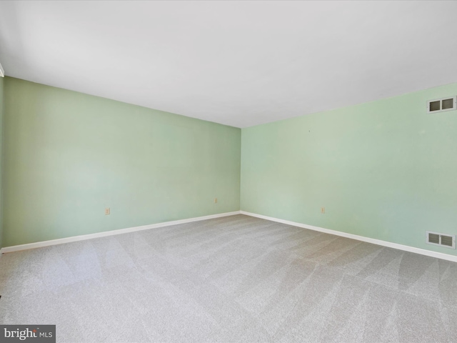 unfurnished room featuring carpet