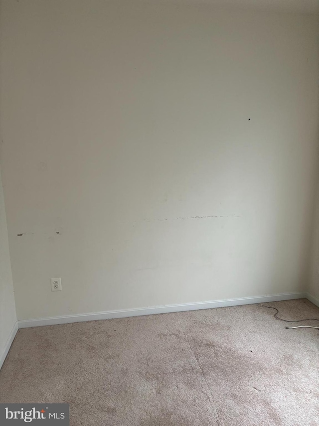 unfurnished room featuring carpet flooring