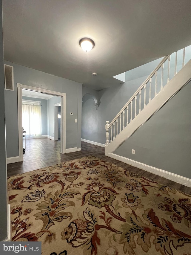 unfurnished room featuring dark hardwood / wood-style floors