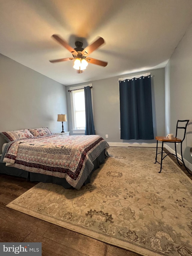 bedroom with hardwood / wood-style flooring and ceiling fan