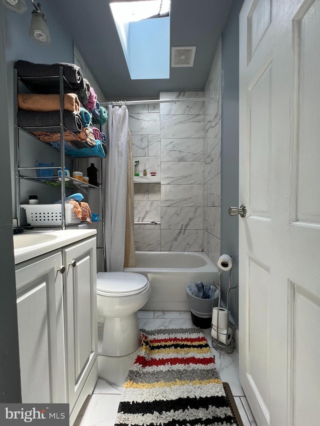 full bathroom featuring shower / tub combo with curtain, vanity, toilet, and a skylight