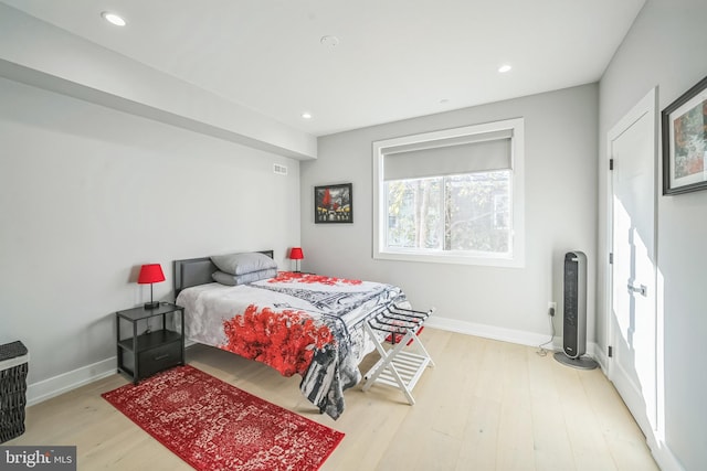 bedroom with hardwood / wood-style flooring