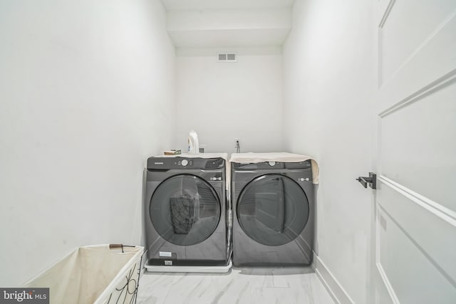 laundry room with washer and dryer