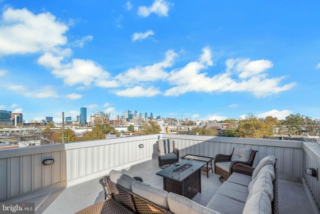 view of patio / terrace featuring an outdoor living space with a fire pit