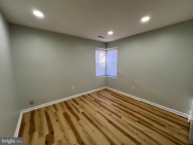 empty room with light hardwood / wood-style floors