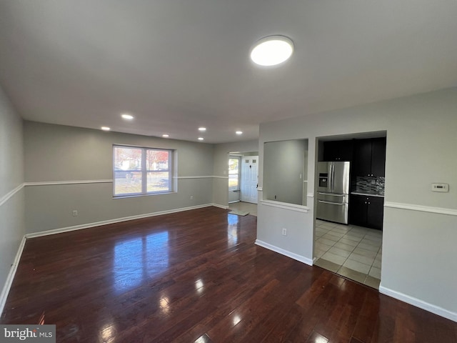 unfurnished room with wood-type flooring