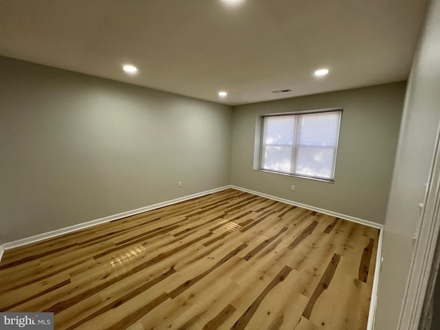 spare room featuring light hardwood / wood-style flooring