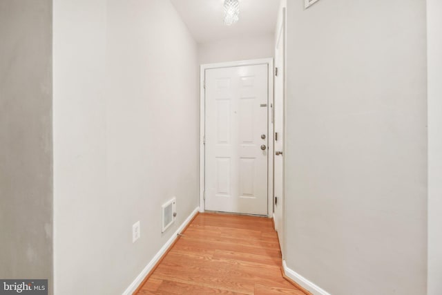 hallway with light wood-type flooring