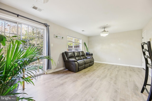 living room with light hardwood / wood-style flooring