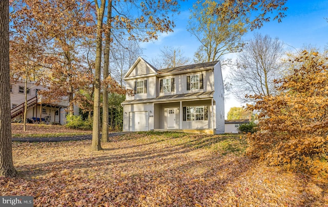 view of front of house with a garage and covered porch