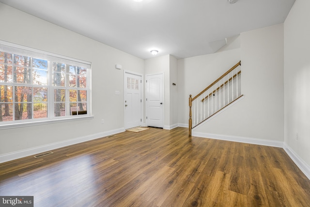 entrance foyer with dark hardwood / wood-style floors