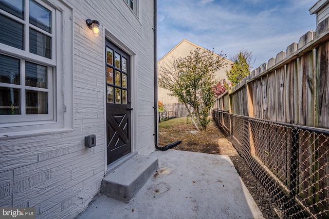 property entrance with a patio