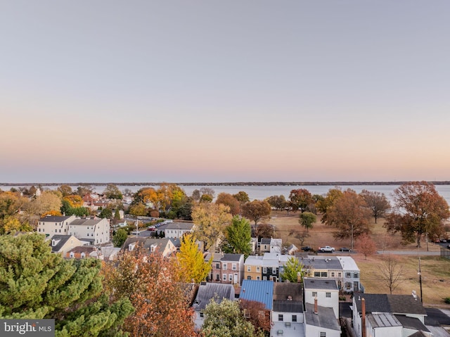 aerial view at dusk with a water view