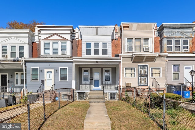 view of property with a porch and central AC unit