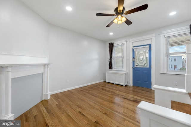 entryway with ceiling fan and light hardwood / wood-style floors