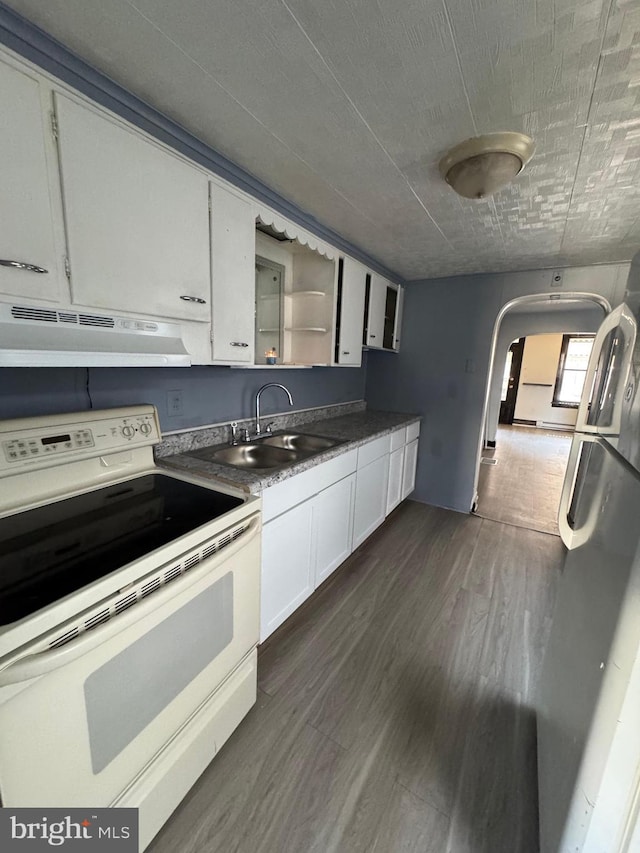 kitchen with white cabinetry, dark hardwood / wood-style flooring, ventilation hood, and white range with electric stovetop