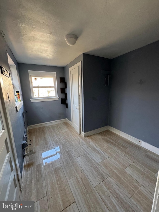 spare room featuring light hardwood / wood-style flooring