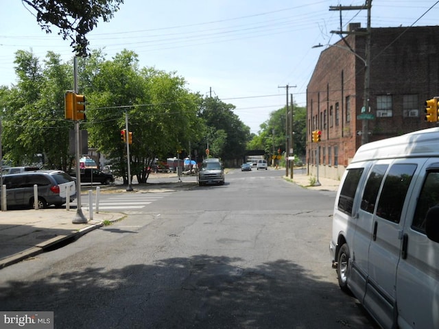 2304 N 25th St, Philadelphia, PA 19132 - view of asphalt road featuring traffic lights and traffic signs