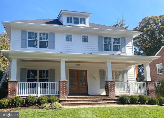 view of front of property with french doors and a porch