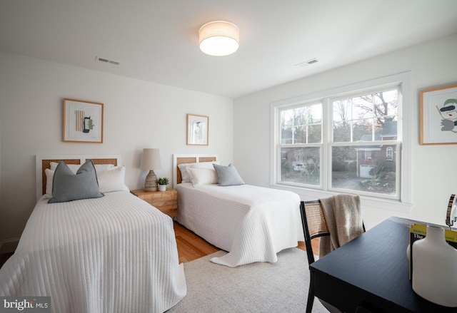 bedroom with light hardwood / wood-style floors