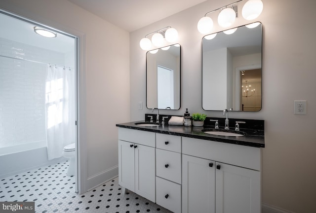 full bathroom featuring toilet, shower / bath combo, vanity, and tile patterned floors