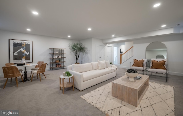 living room featuring light carpet