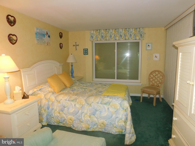 bedroom with dark colored carpet