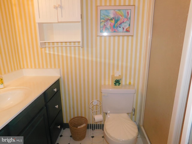 bathroom featuring an enclosed shower, vanity, and toilet