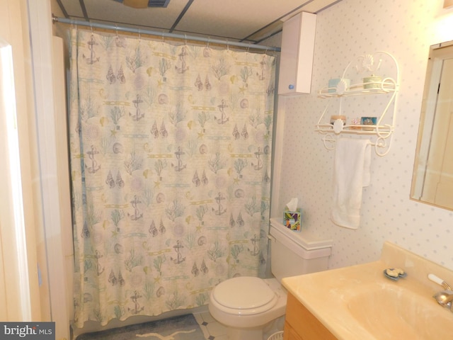 bathroom with tile patterned floors, vanity, a shower with shower curtain, and toilet