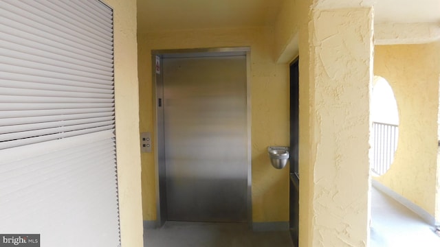 hallway featuring elevator