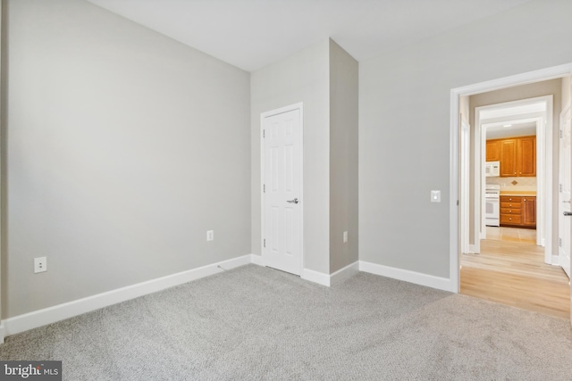 unfurnished bedroom with light carpet