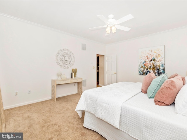 bedroom featuring ornamental molding, light carpet, and ceiling fan