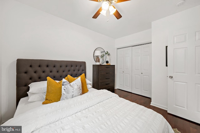 bedroom with ceiling fan, a closet, and dark hardwood / wood-style flooring