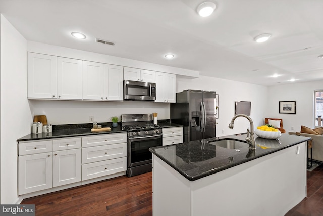 kitchen featuring stainless steel appliances, dark hardwood / wood-style floors, white cabinetry, and sink