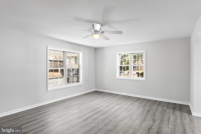 unfurnished room featuring hardwood / wood-style flooring and ceiling fan