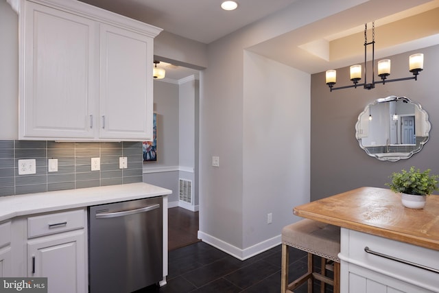 kitchen featuring dark wood-type flooring, dishwasher, white cabinets, tasteful backsplash, and decorative light fixtures