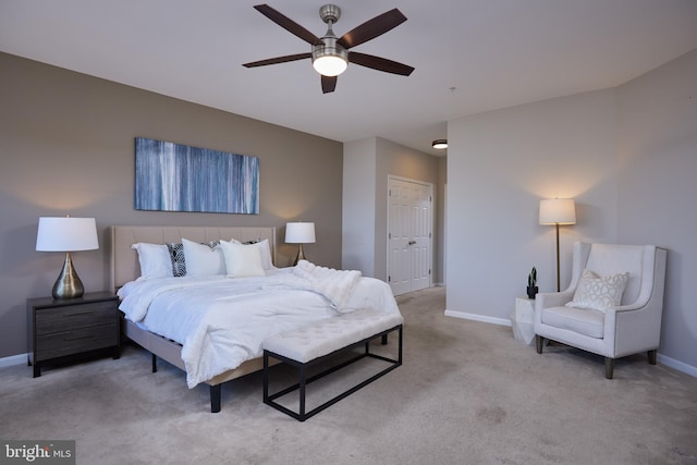 carpeted bedroom featuring a closet and ceiling fan