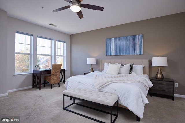 bedroom with light carpet and ceiling fan