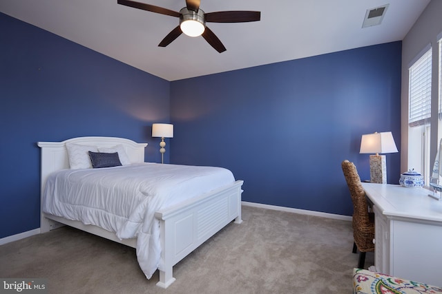 carpeted bedroom with ceiling fan