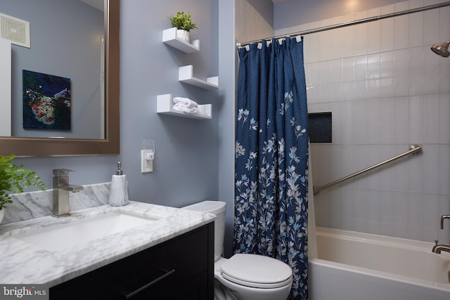 full bathroom with shower / bath combo, vanity, and toilet