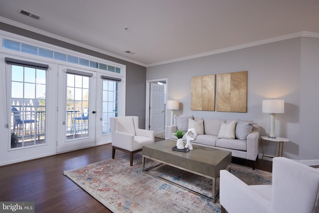 living room featuring dark hardwood / wood-style flooring, french doors, and ornamental molding