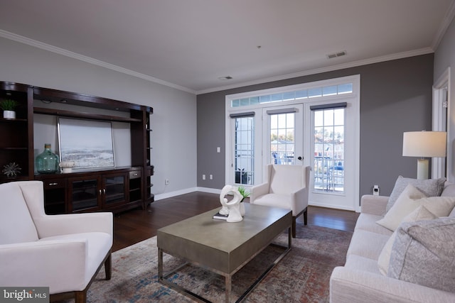 living room with dark wood-type flooring, french doors, and ornamental molding