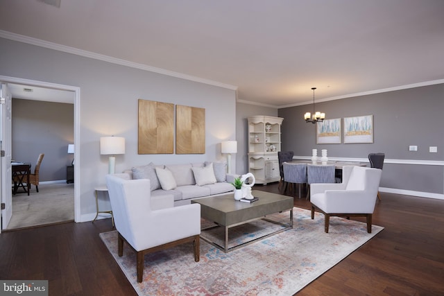 living room featuring a notable chandelier, dark hardwood / wood-style floors, and crown molding