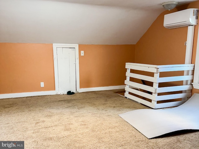 additional living space with carpet, vaulted ceiling, and a wall mounted air conditioner