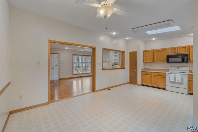 kitchen with light hardwood / wood-style flooring, a skylight, ceiling fan, and white electric range oven