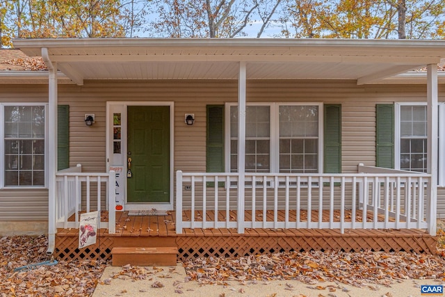 doorway to property featuring covered porch