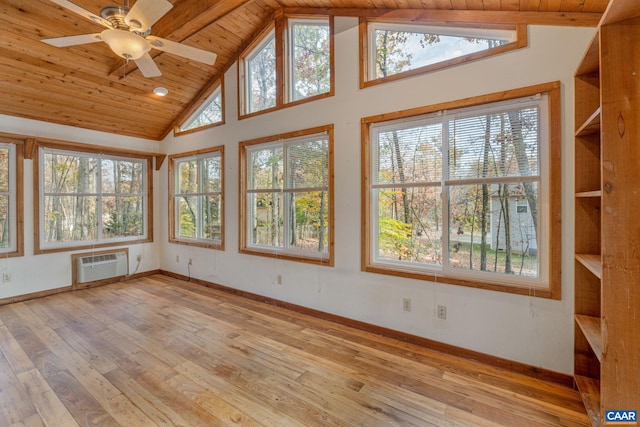 unfurnished sunroom with ceiling fan, wood ceiling, lofted ceiling, and a wall mounted AC