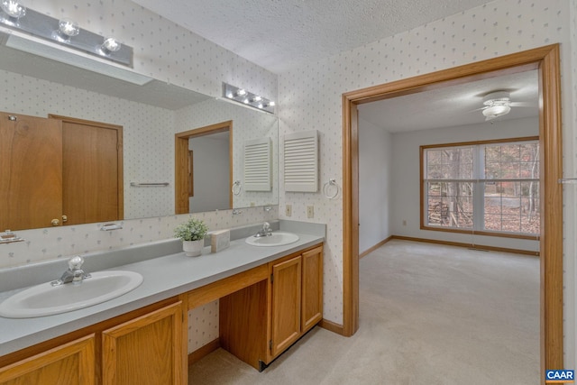 bathroom with vanity and a textured ceiling