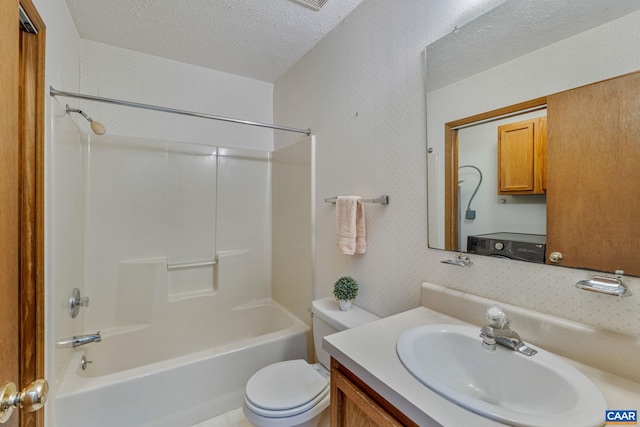 full bathroom featuring toilet, shower / tub combination, vanity, and a textured ceiling